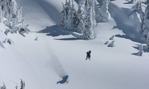 Andrew Munster doing a massive drop on his snowmobile. 