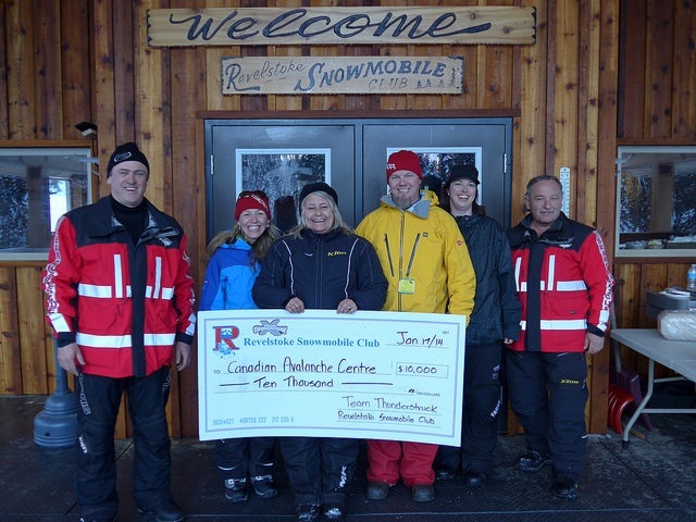 Left to Right Brad McStay Carole Savage Kathy Burke Brent Strand Donegal Wilson and Dave NinKovich Presenting a donation to the Canadian Avalanche Center from the Revelstoke Snowmobile club team Thunderstruck fundraising event. 