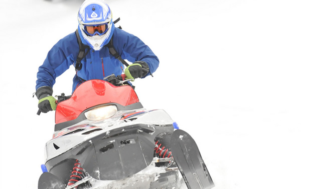 snowmobiler riding his sled