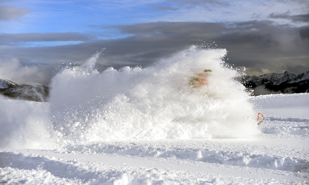 A wave of snow engulfs a rider in Revelstoke. 