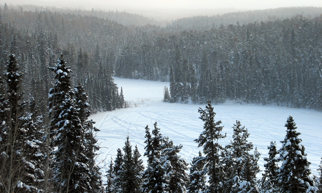 A scenic overlook of lakes and forest. 