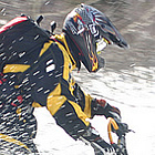 man snowmobiling 