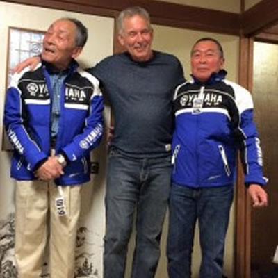 Chris Reid, centre, with Yahama corporate executives.