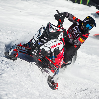 Corin Todd on snowmobile. 