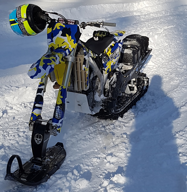 RMZ 450 outfitted with a Timbersled snow bike kit. 