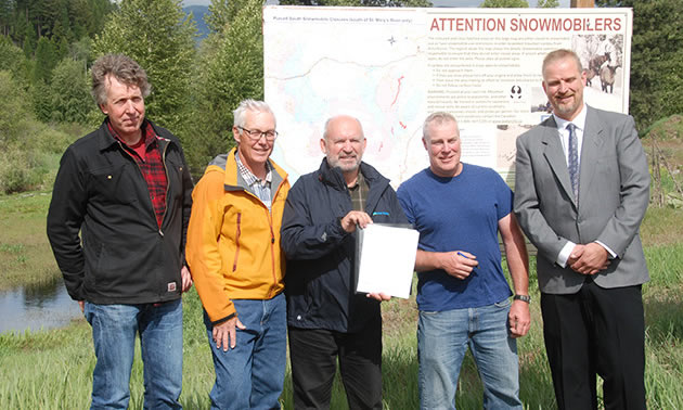 A new agreement between the Cranbrook Snowmobile Club and the BC government will help preserve local Caribou habitat. Pictured above: John Krebs (Director, Resource Management, FLNRO), Doug Hogg (past president, Cranbrook Snowmobile Club), Bill Bennett (Kootenay East MLA), Mike Plant (president, Cranbrook Snowmobile Club), Paul Rasmussen, Regional Executive Director, FLNRO).