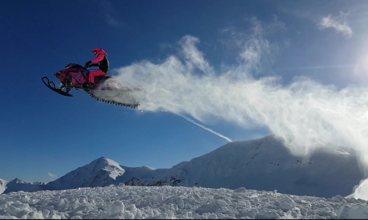 Kayli Dentman catching air on her sled