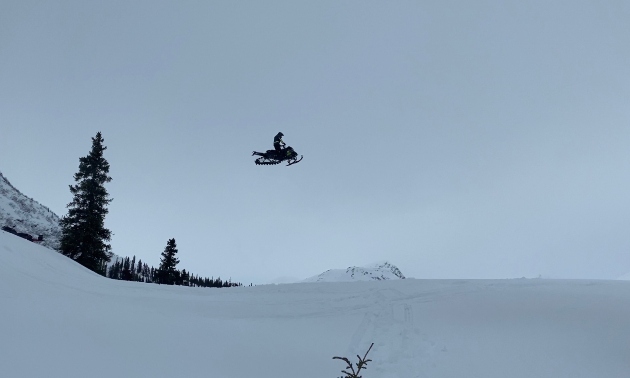 A sledder jumping through the air