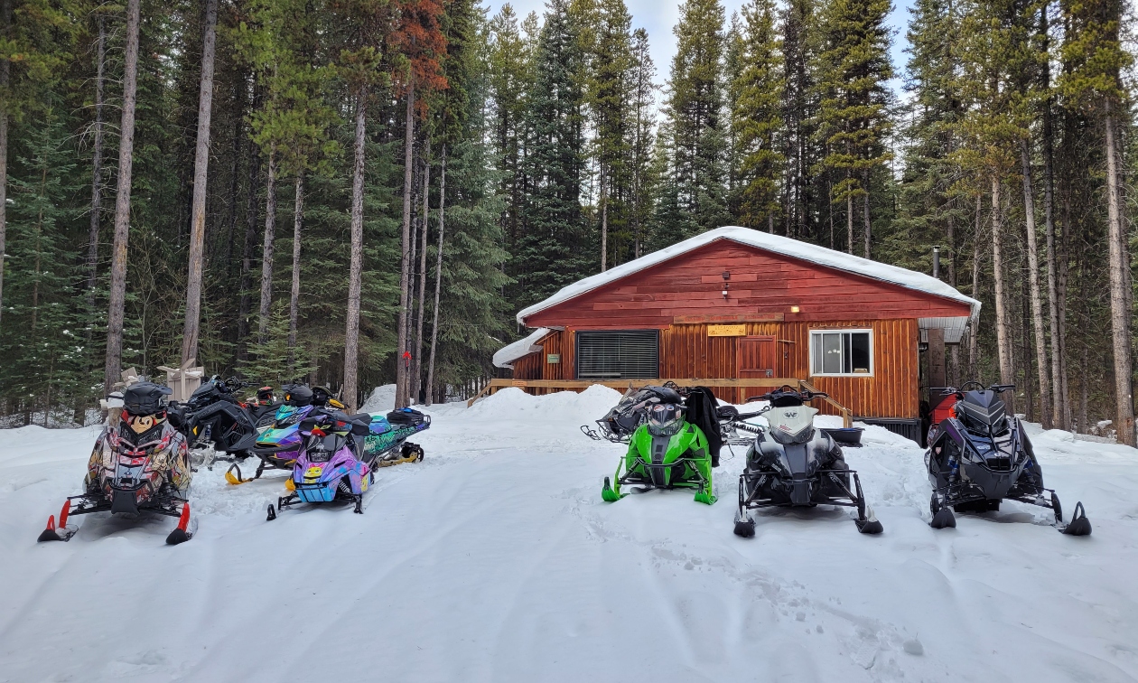 sleds outside a cabin