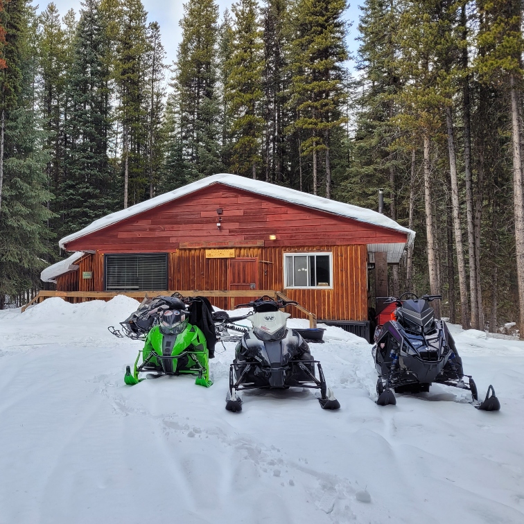 sleds outside a cabin