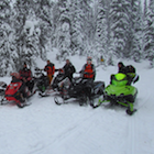 People on snowmobiles.