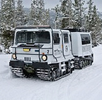 picture of snowmobiler and snowcat