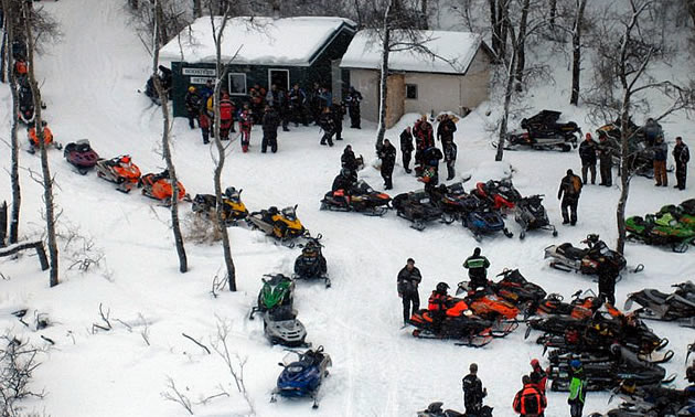 An aerial shot of snowmobilers during a poker derby. 