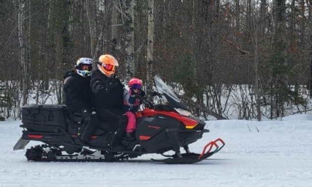 People on snowmobiles