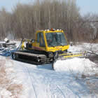 A snowmobile trail grooming machine out on the trail