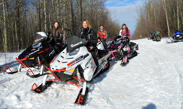 Four snowmobilers on Polaris Pro-RMK sleds in Whitecourt. 