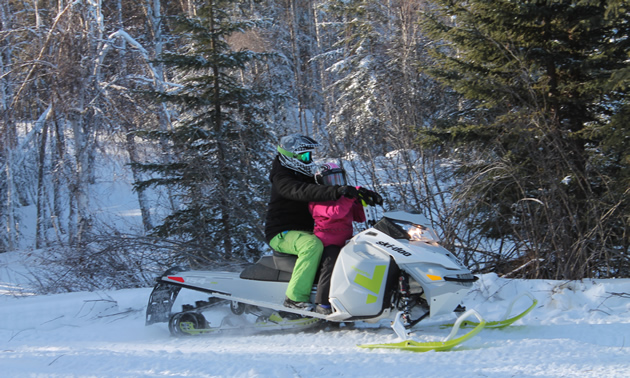 Sledders on their way into a warm-up shelter at the top of Watt Mountain