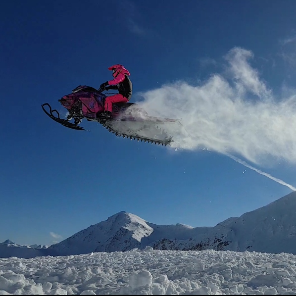Kayli Dentman catching air on her sled