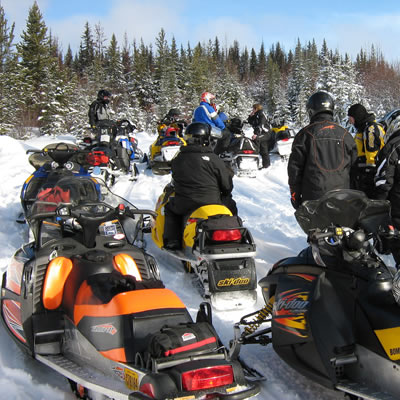 Group of snowmobilers on the Gold Rush Snowmobile Trail.