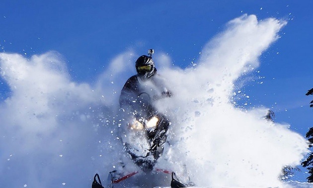 Josh Hartikainen spraying powder up all around him. 