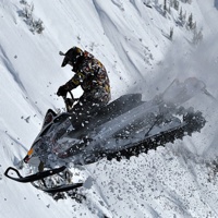 Jeremy Hanke executing a jump on his snowmobile. 
