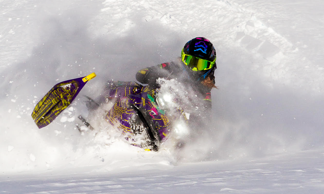 Kelsey Fay crashing through snow on her sled