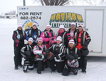 women gathered around wearing winter gear