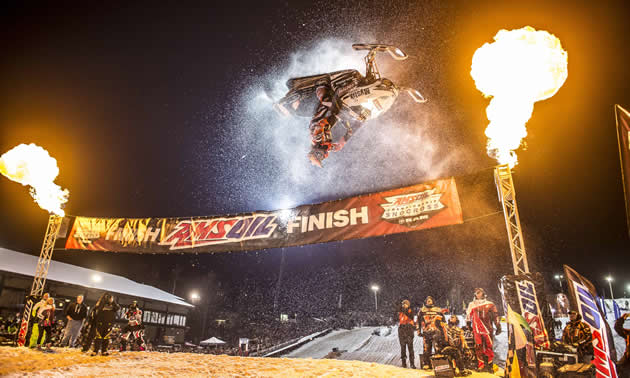 Levi LaVallee doing a backflip at snocross. 