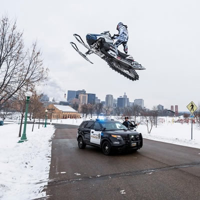 X-Games champ Levi LaVallee jumps over a police car in a Red Bull video. 
