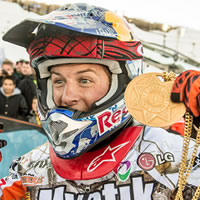 Levi LeValle holding up a gold medal from the Winter X Games. 