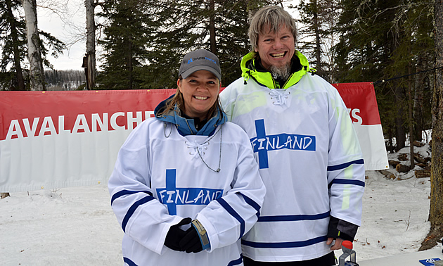 Lori Zacaruk and Brent Strand wearing Finland jerseys. 