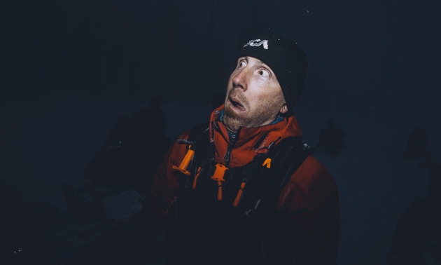 A dark shot showing Marshall's face illuminated