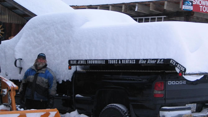 A truck showing one metre of snow dumped on it overnight