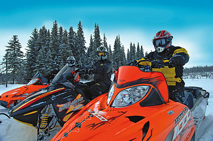People on snowmobiles