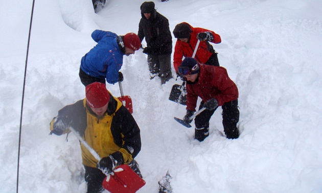 5 students demonstrating the conveyor shovel method.