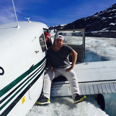 Passengers and pilot climb out of a downed airplane stranded on the Pemberton Glacier in this CBC photo.
