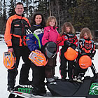 Family on sleds