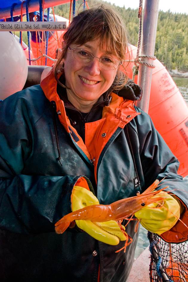 Laura Rasmussen holding a prawn. 