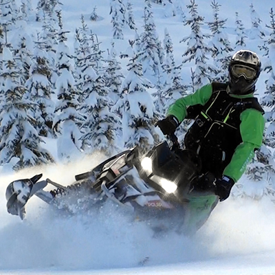 A mountain sledder carves fresh powder in the BC backcountry. 