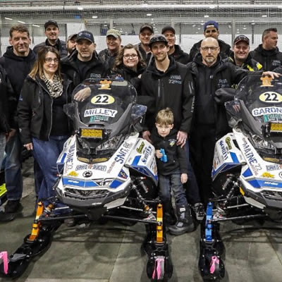 Photo of group of snowmobilers. 