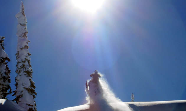 Randy Swenson riding into the sunlight in Revelstoke. 