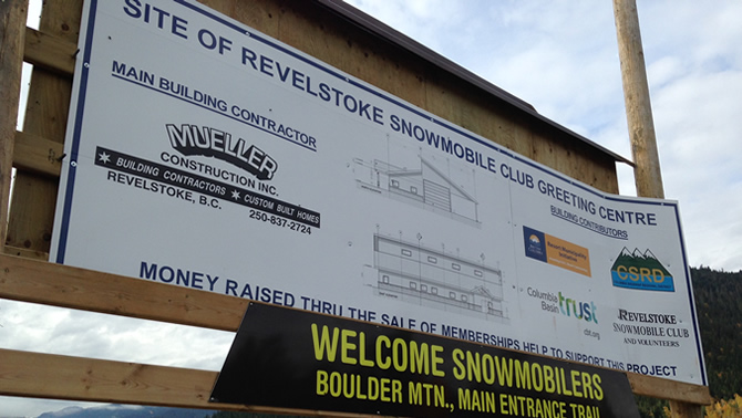 Billboard with details of the new Revelstoke Snowmobile Centre. 