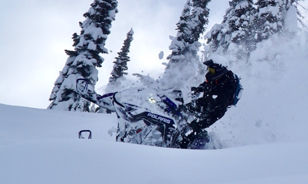 Rijel Hunley crashing through powdery snow on his sled