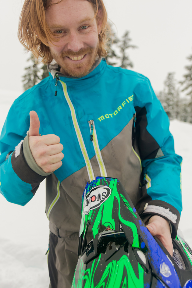 Ryan Thorley with his helmet off, giving the thumbs up. 