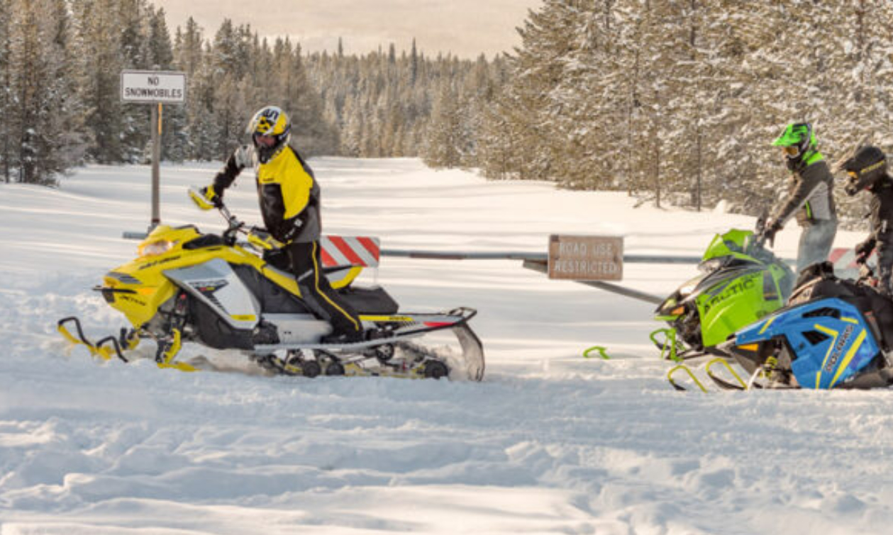 person in yellow on a yellow sled
