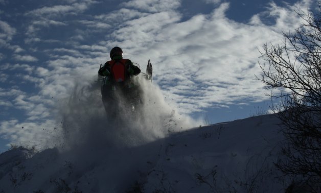 A sledder catching some air on the Saskatoon Snowmobile Club's trails.