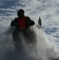 A sledder catching some air on the Saskatoon Snowmobile Club's trails.