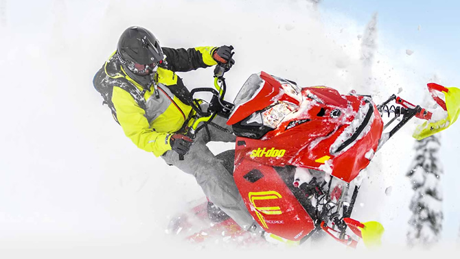 Picture of snowmobiler riding a Ski-Doo. 