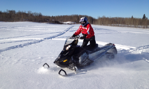 Katrina Yaworski rides a 2012 Ski-Doo Summit.