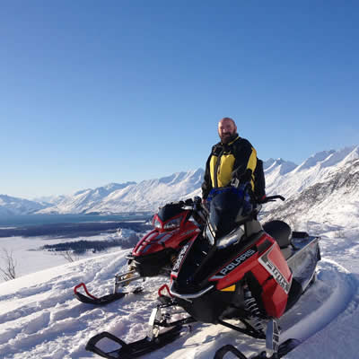 Scott Benda on a beautiful bluebird day of snowmobiling in Valdez, Alaska.  